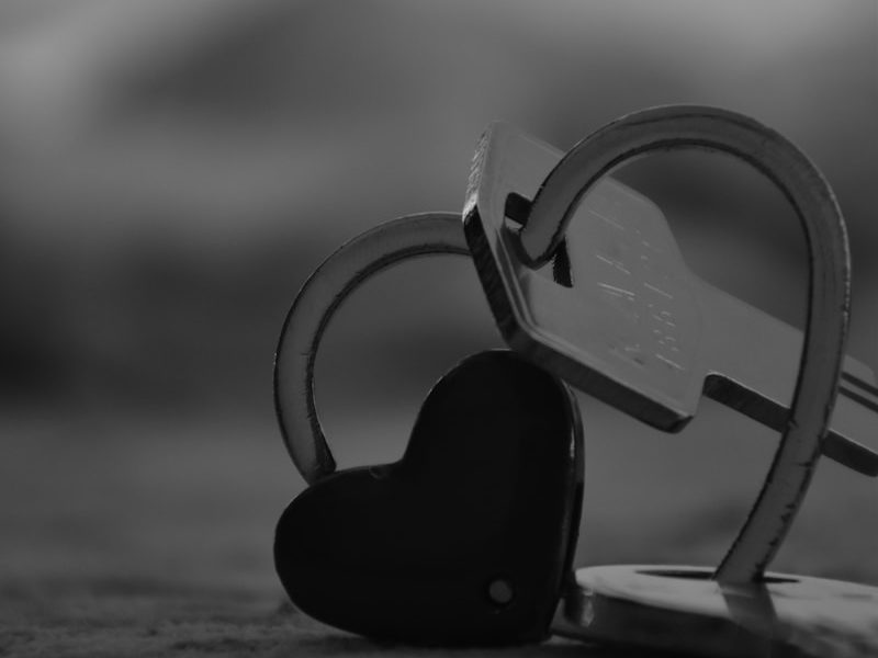 a pair of scissors and a heart shaped key